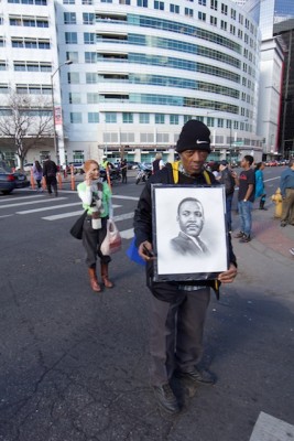 Denver Marade marcher with MLK picture in front of Denver Post building, Jan 2015